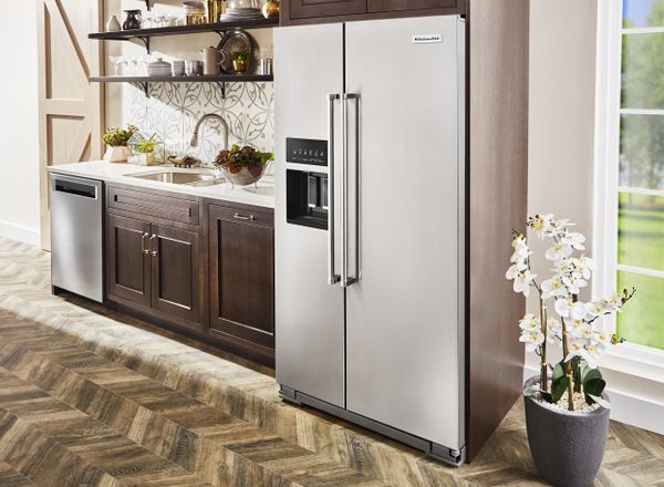 A KitchenAid counter depth refrigerator in a kitchen