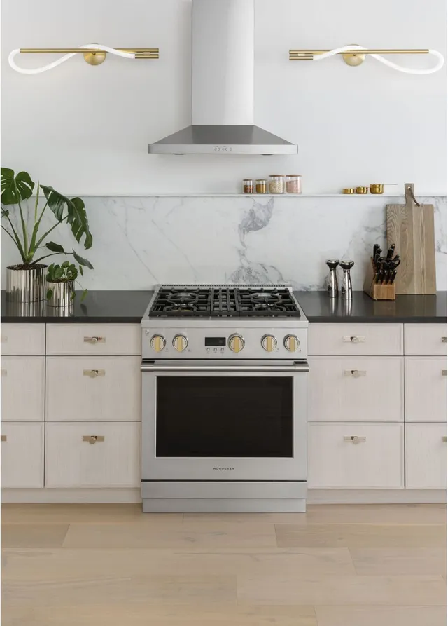 The Monogram ZGP304NTSS 30” gas range in a luxury kitchen 