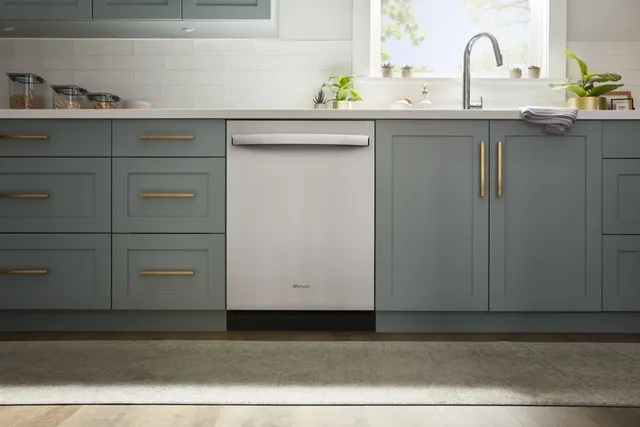 The Whirlpool WDT730HAMZ stainless steel dishwasher in a kitchen 