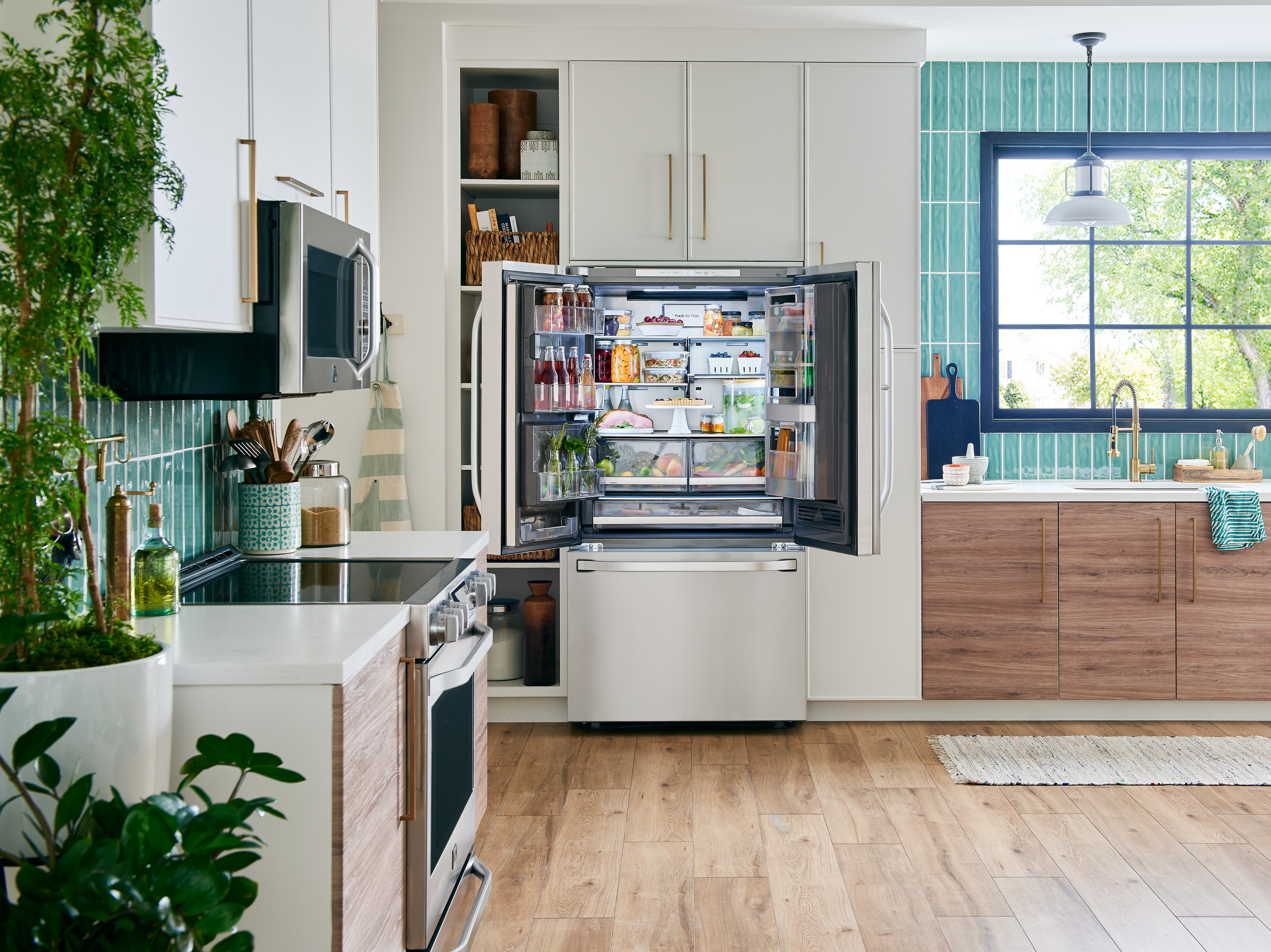 wide open LG fridge in a modern kitchen