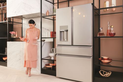 Woman Standing Next to Luxury Refrigerator