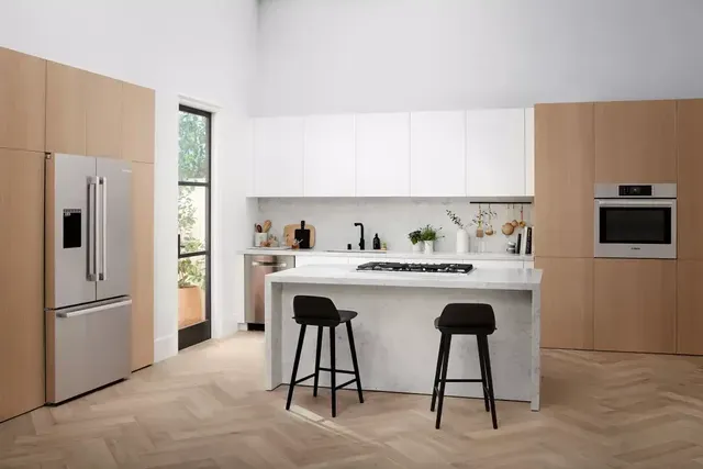 A kitchen featuring a Bosch refrigerator, wall oven, cooktop, and dishwasher 