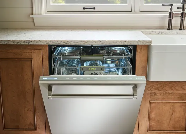 The Cove DW2450 dishwasher with its door slightly ajar 