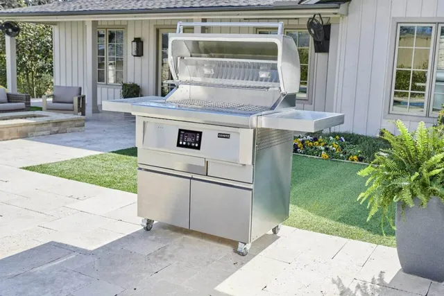 The Coyote 36” pellet grill in a backyard 