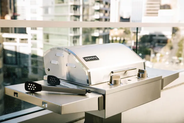 The Coyote C Series 18” electric grill on a balcony 
