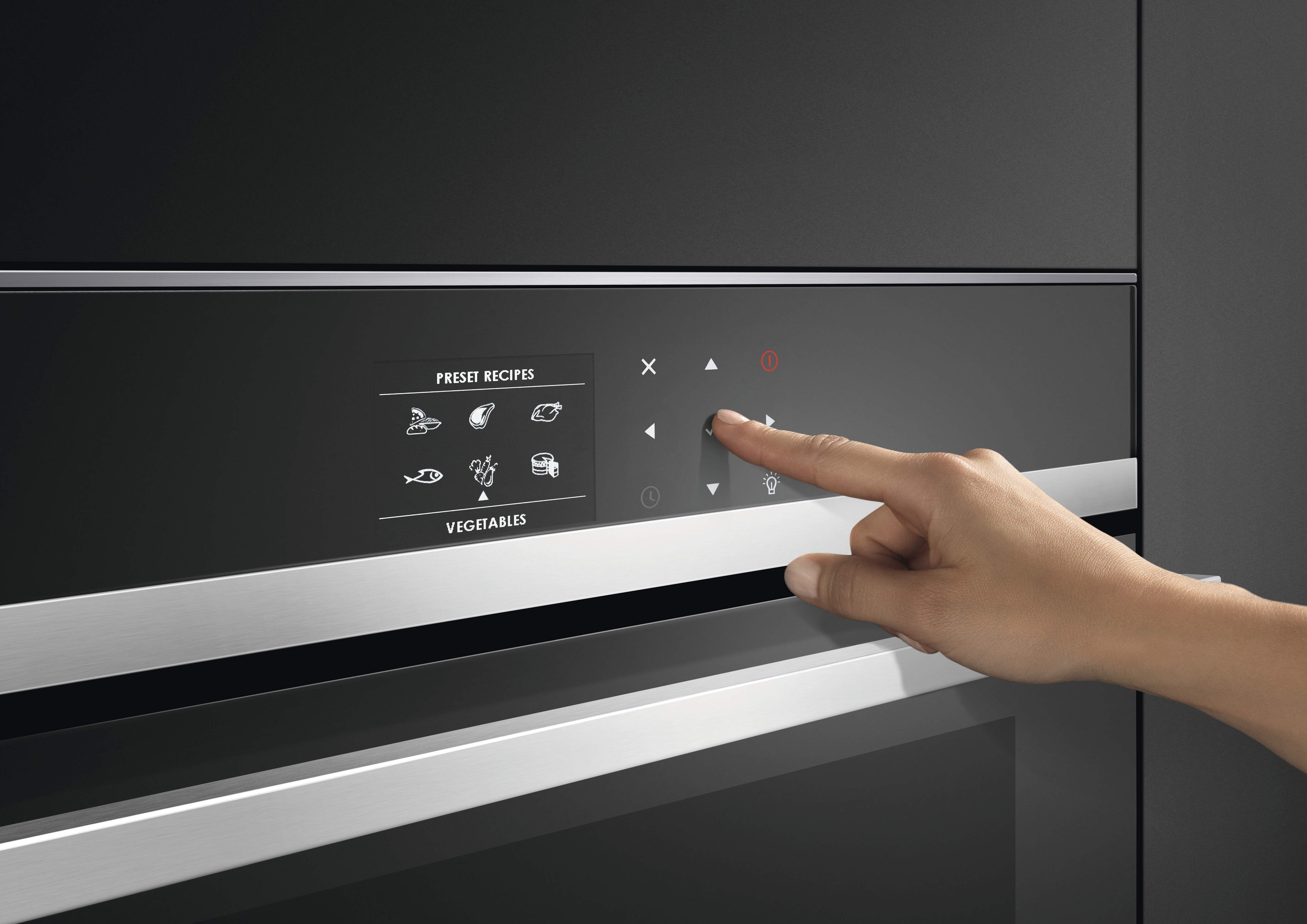 A person selecting a cooking mode on a Fisher & Paykel wall oven 