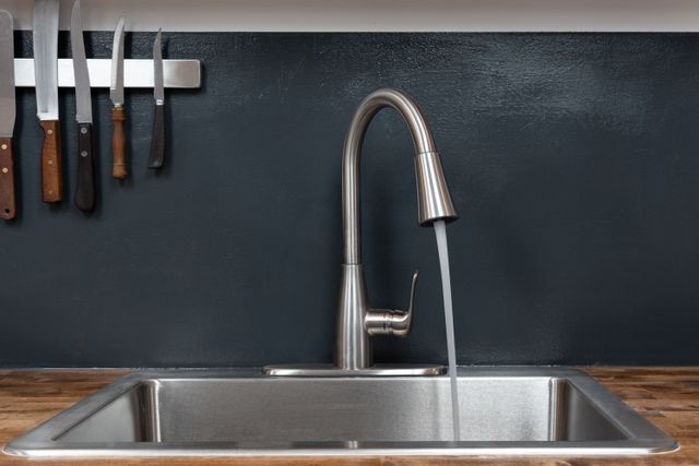 front view of a luxury kitchen faucet in a contemporary kitchen