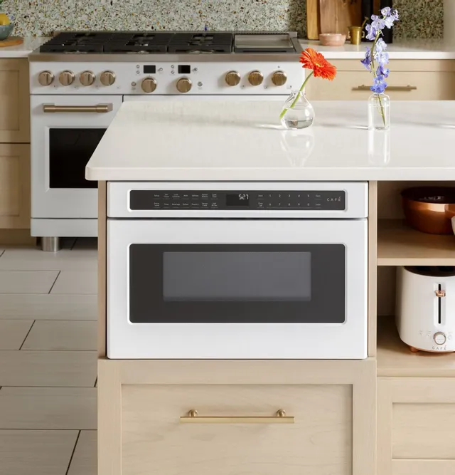 the Café CWL112P3RD5 microwave drawer in matte white installed in a kitchen 