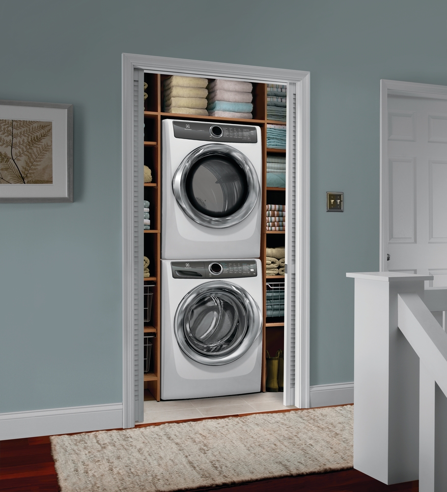 lifestyle image of whirlpool EFLS527UIW and EFDE527UIW stacked laundry pair