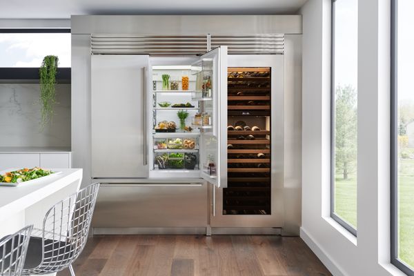 A Sub-Zero 48” built-in French door refrigerator with a matching wine cellar