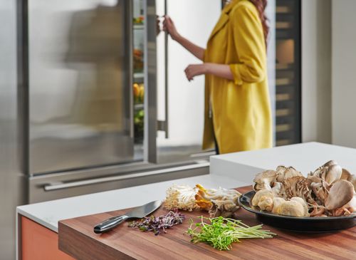 Woman Opening up Refrigerator