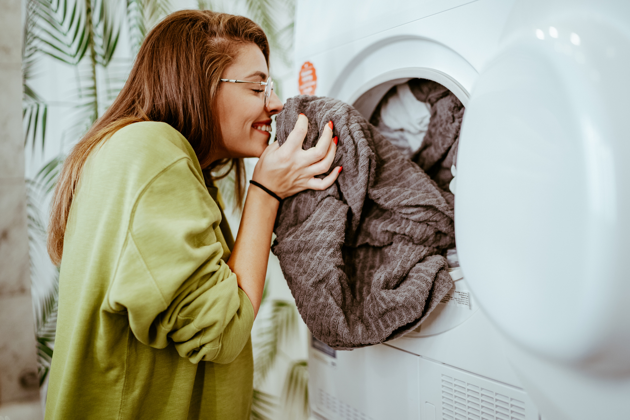 woman enjoying the scent of fresh laundry