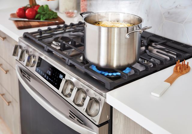 close view of a pot of pasta cooking on a 36" gas range