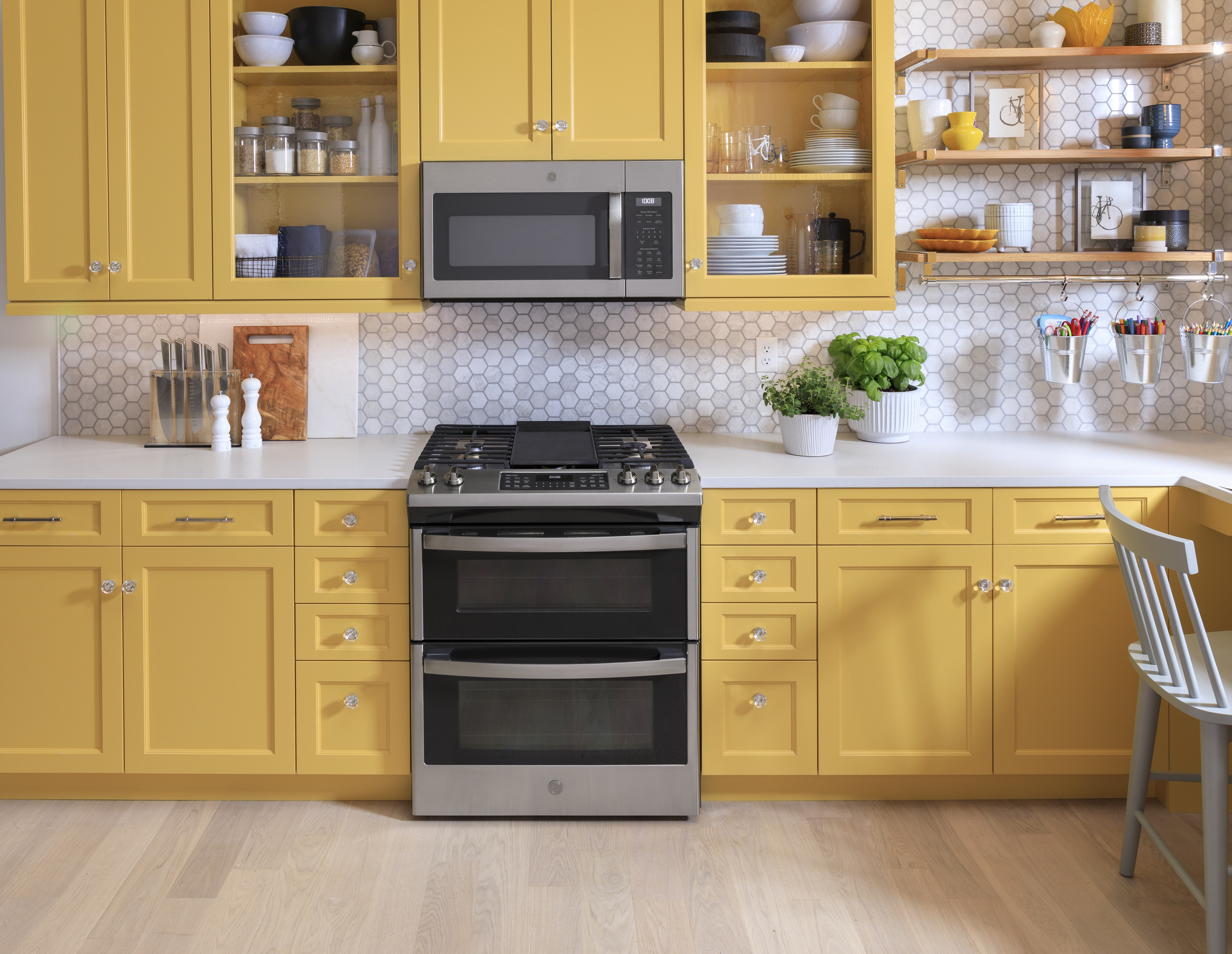 GE stainless-steel slide-in double-oven range in modern kitchen