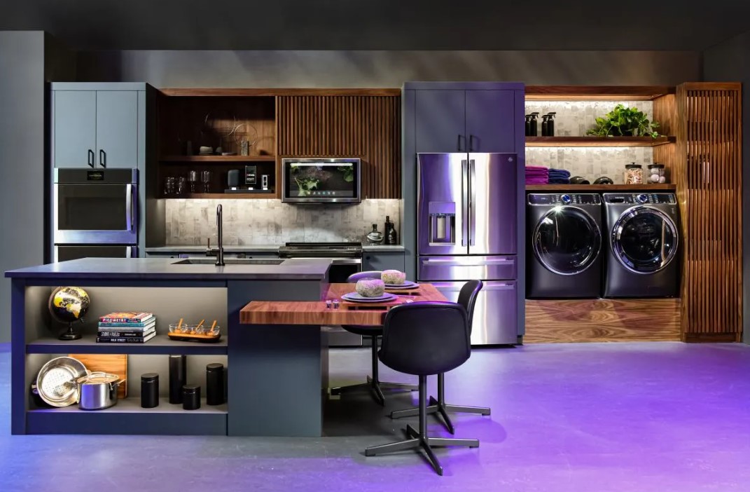 GE Profile appliances are featured in a dark and modern kitchen