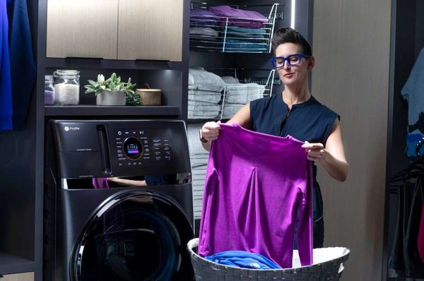 Woman Using an All in One Washer and Dryer