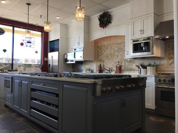Gerhard's appliance showroom featuring premium kitchen appliances including refrigerators, ovens and dishwashers