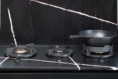 Up close look at PII custom gas burner inserts featured designed by Metro Design Build
