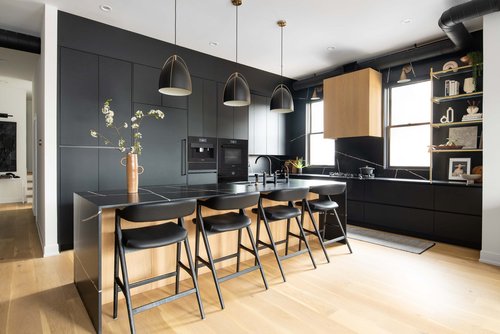 View of Metro Design Build kitchen with Miele appliances and a custom seating area