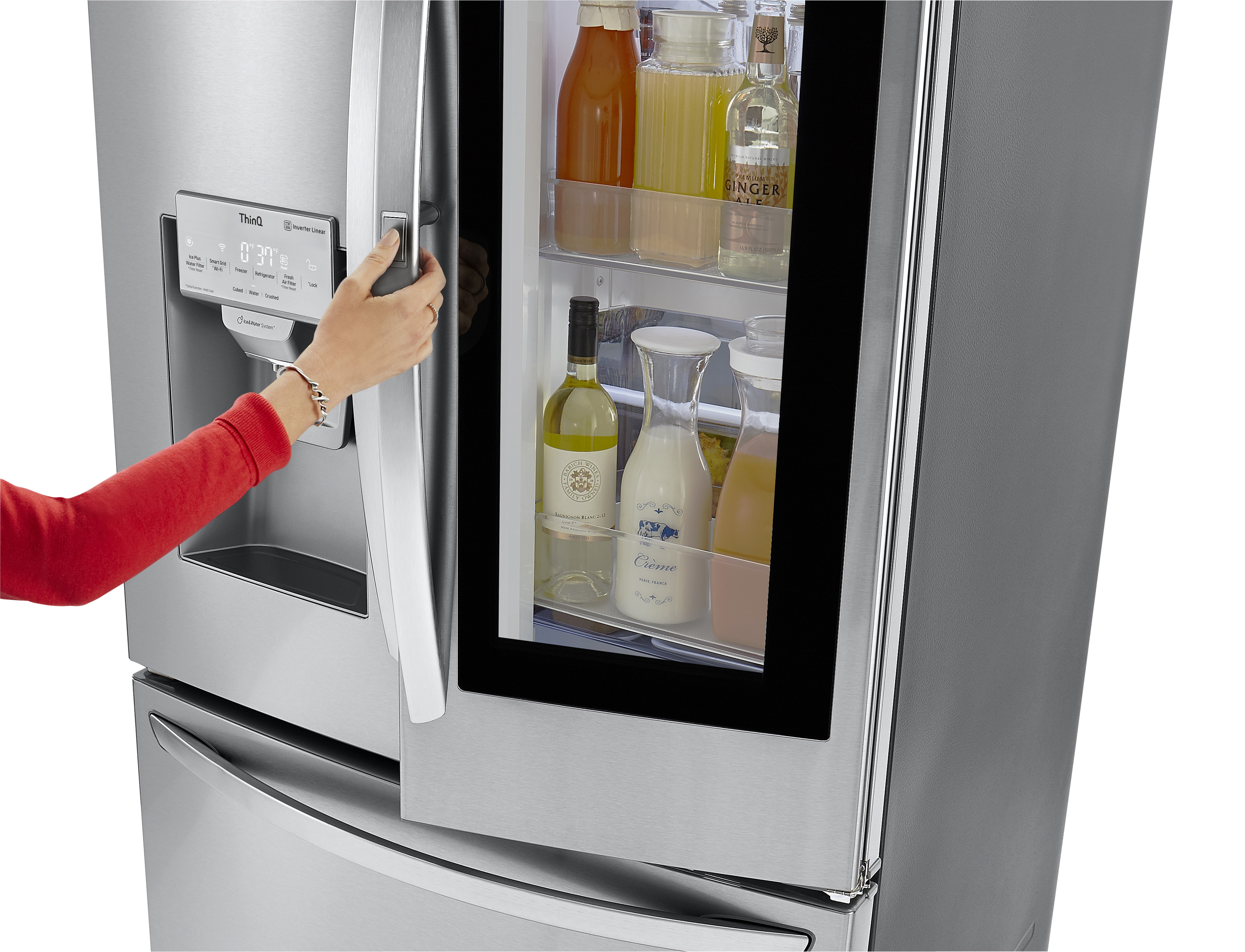 Woman in red long-sleeve shirt using the Door-in-Door feature on LG French door refrigerator