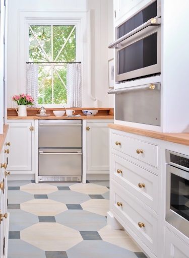 View of Artisan Signature Homes Monogram Southern kitchen with Monogram Advantium oven, warming drawer, and two drawer dishwashers 