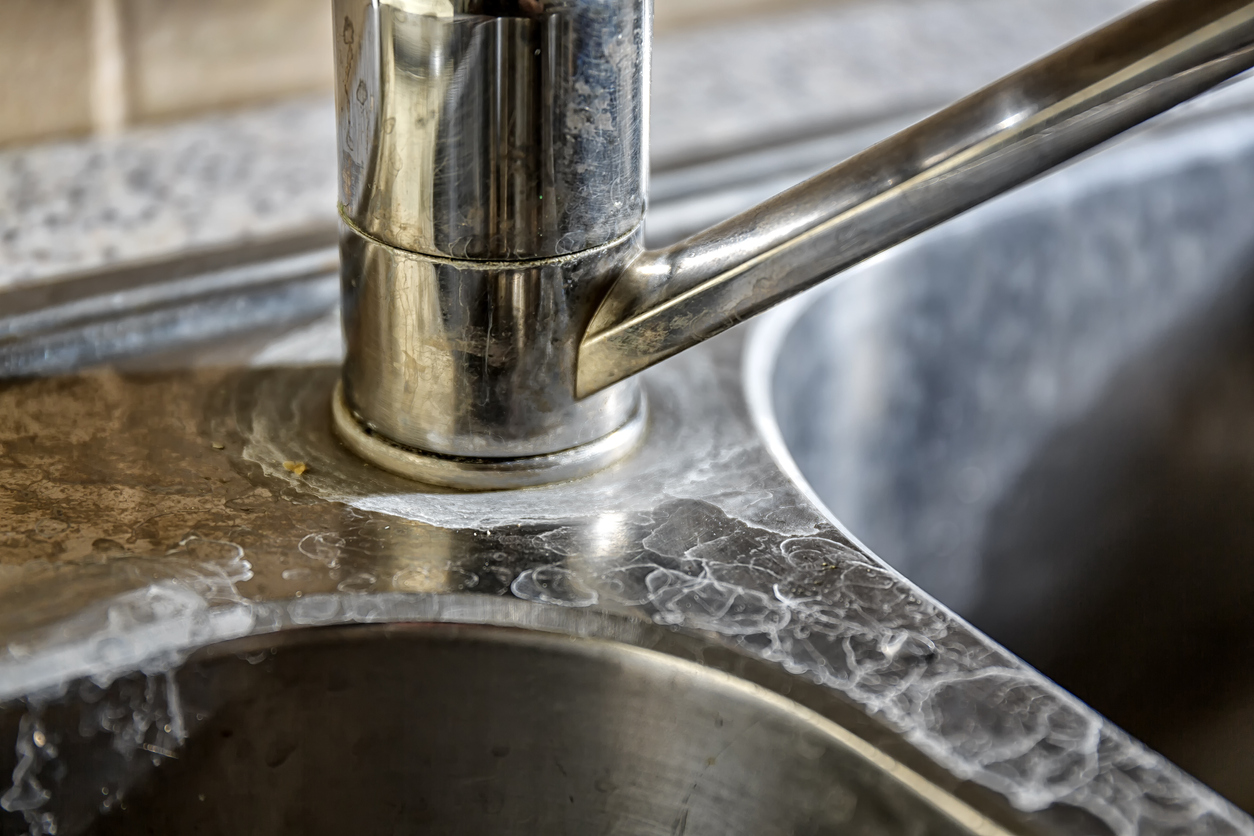 kitchen tap and sink with hard water calcification