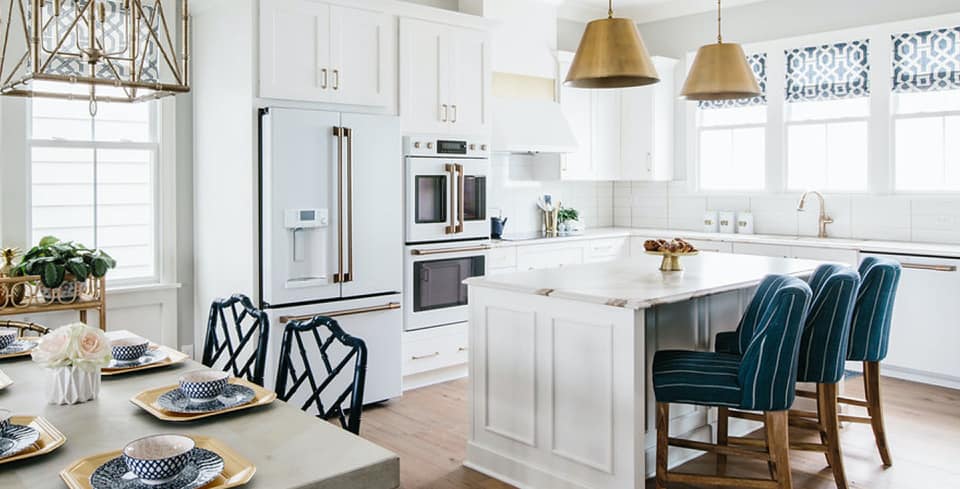 A kitchen featuring white Café appliances 