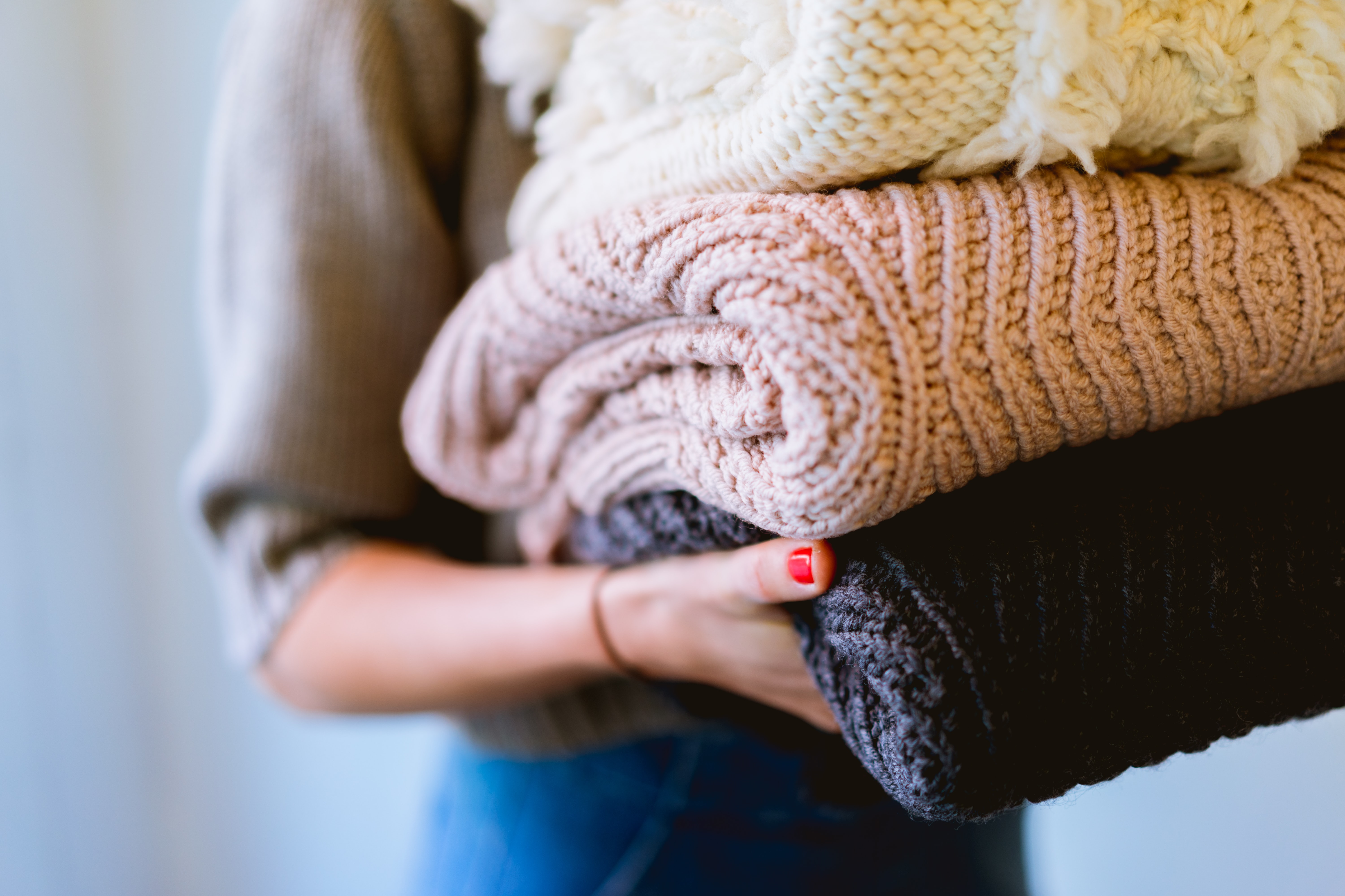 closeup of clean folded sweaters