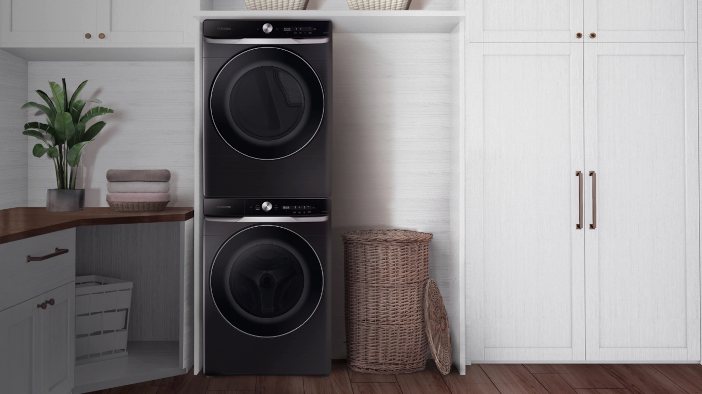 Modern laundry room with a black, stacked Samsung laundry pair
