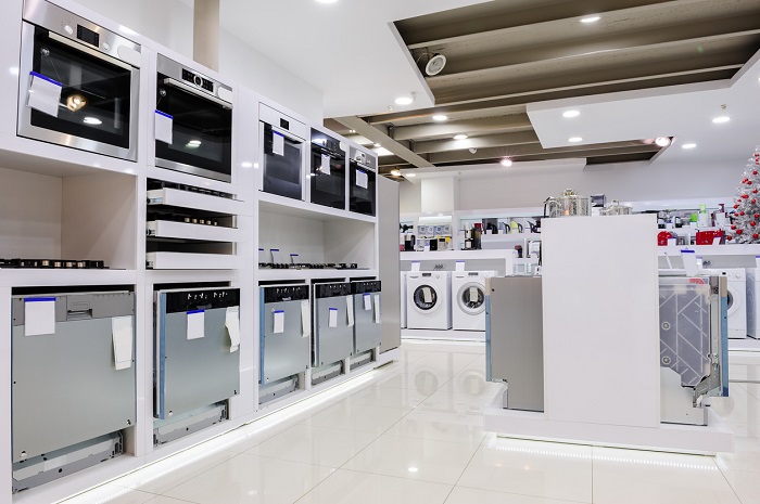 Gas and electric ovens and other home related appliance or equipment in the retail store showroom. 