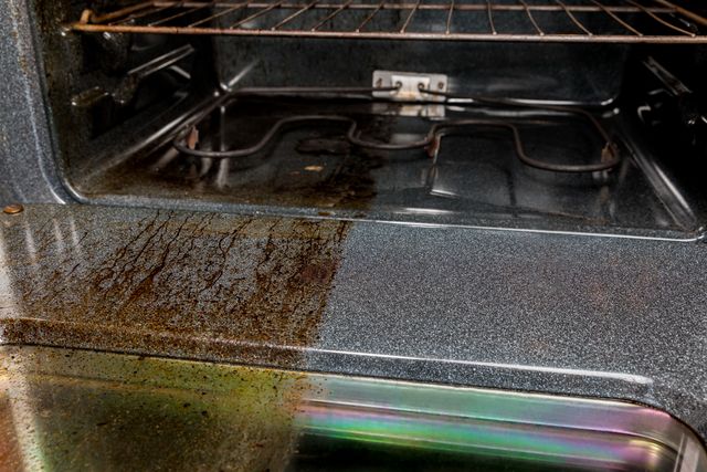 oven half clean half dirty/rusty to show effects of oven self cleaning