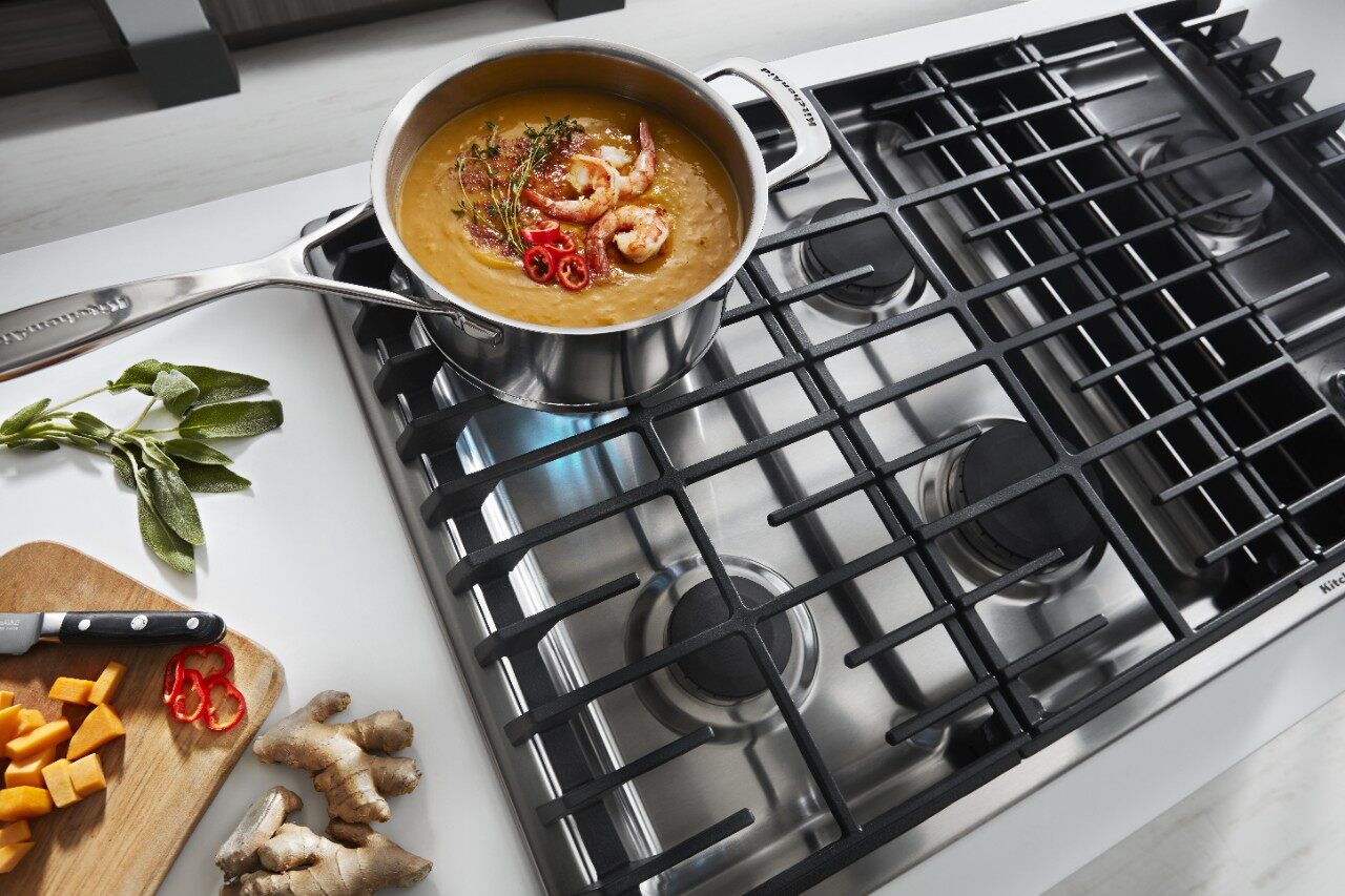 close-up of cooktop with shrimp in a pot