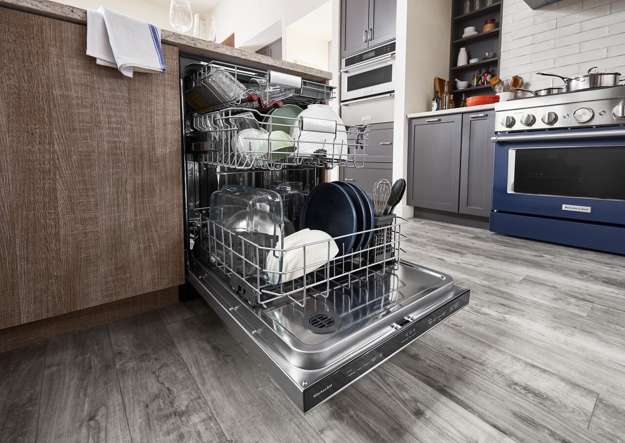 open dishwasher in modern kitchen suite