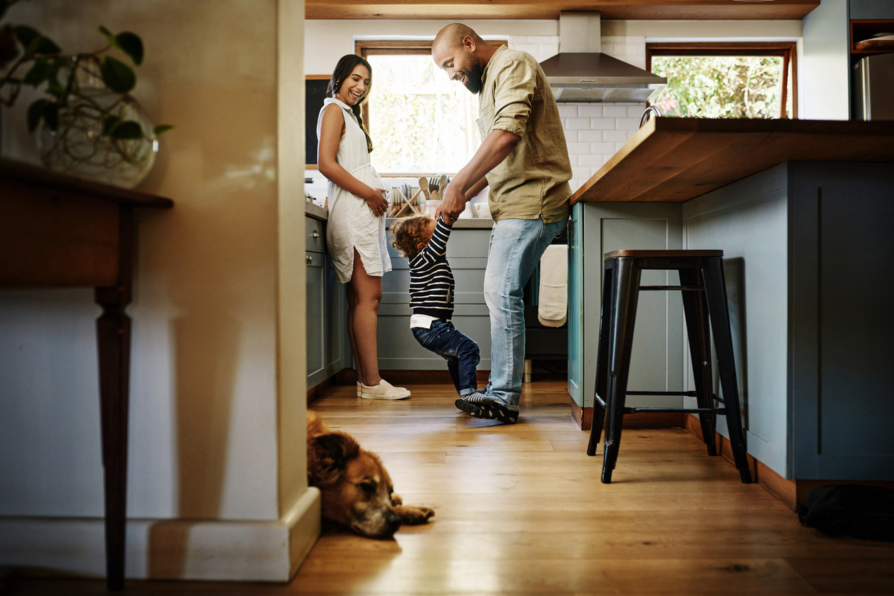 young family spending quality time in the kitchen at home