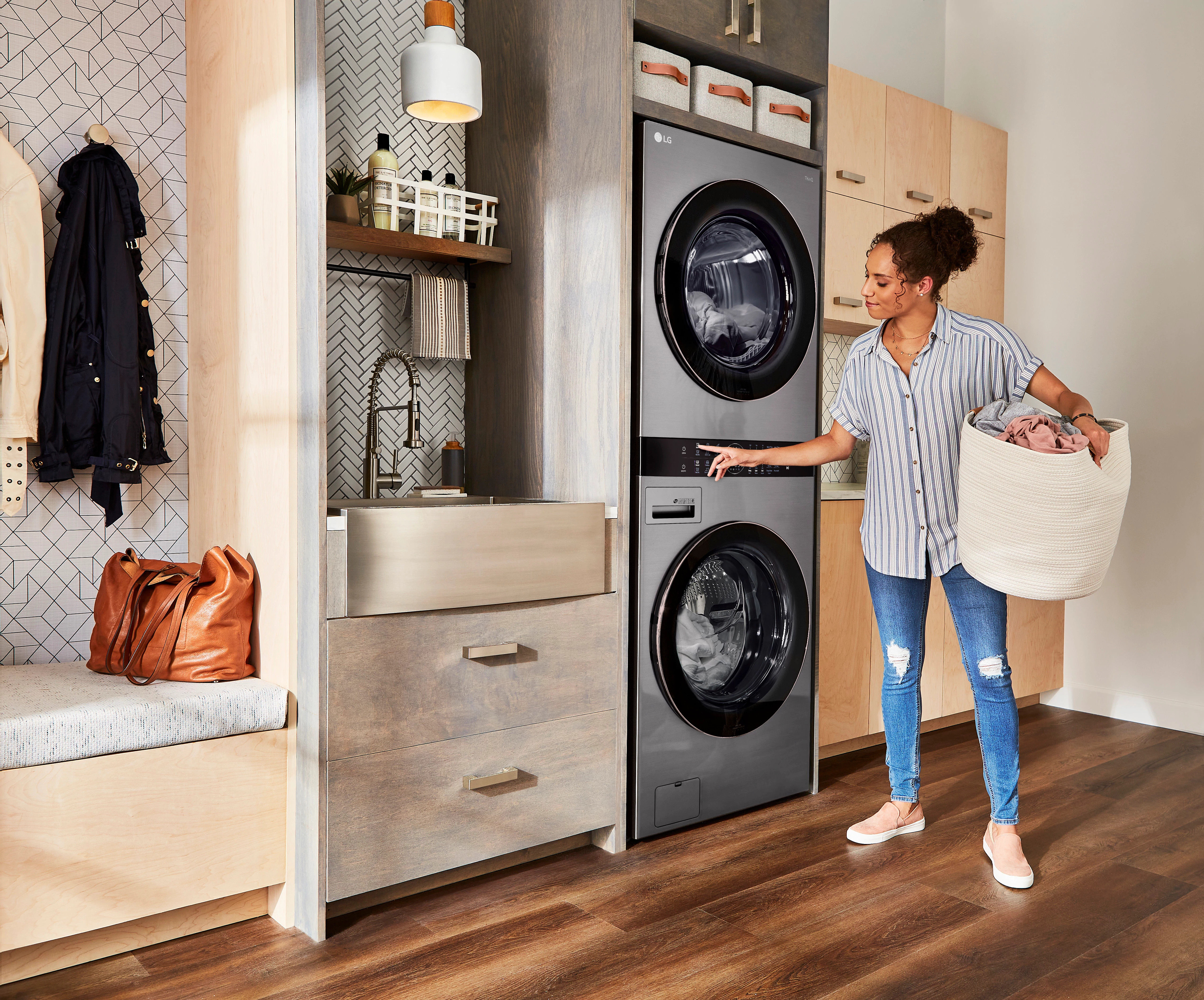 woman waits to unload her LG TWINWash laundry set