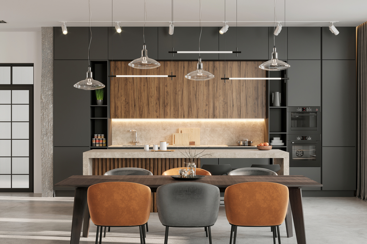 luxury kitchen with dark grey cabinets and panel ready appliances