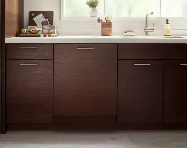 A panel-ready Whirlpool dishwasher in a kitchen