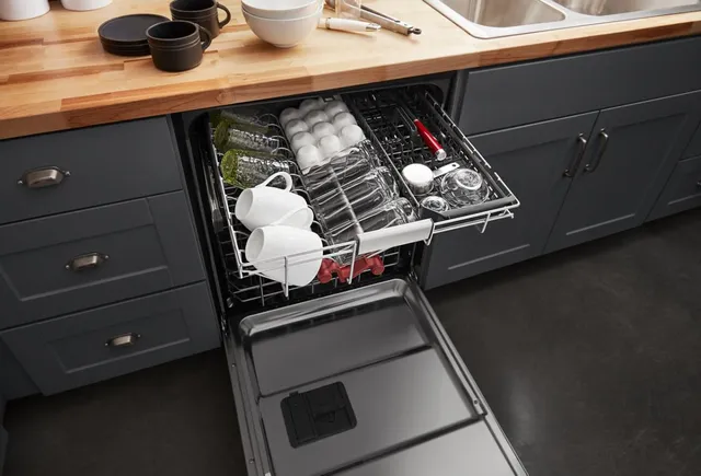 The KitchenAid KDFM404KBS dishwasher with its third rack full extended 