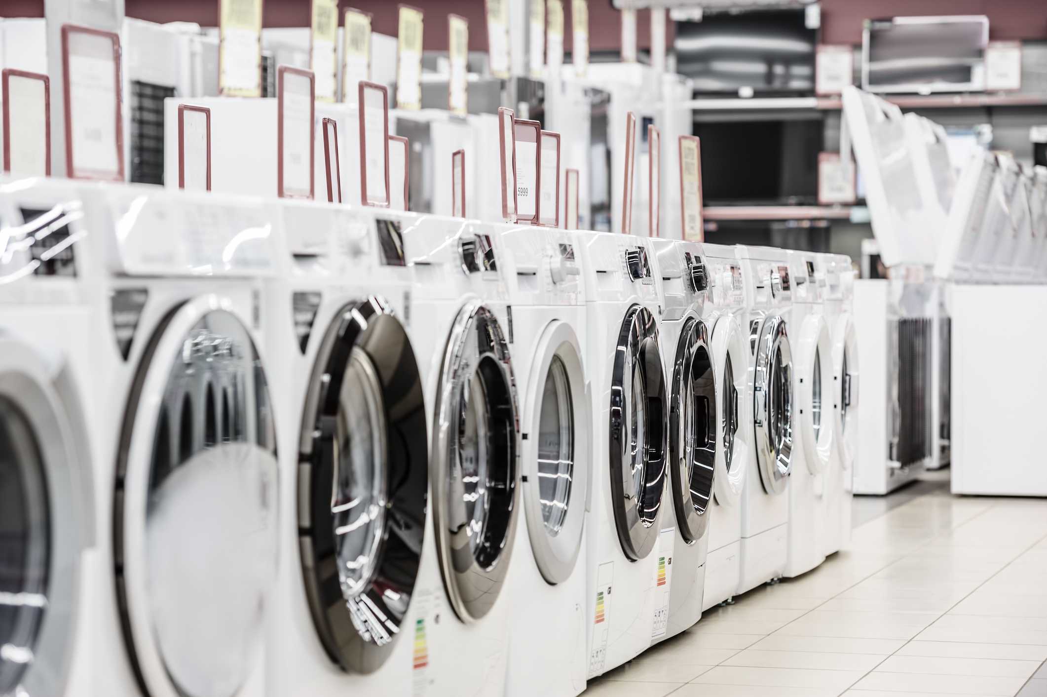row of washers in an appliance store