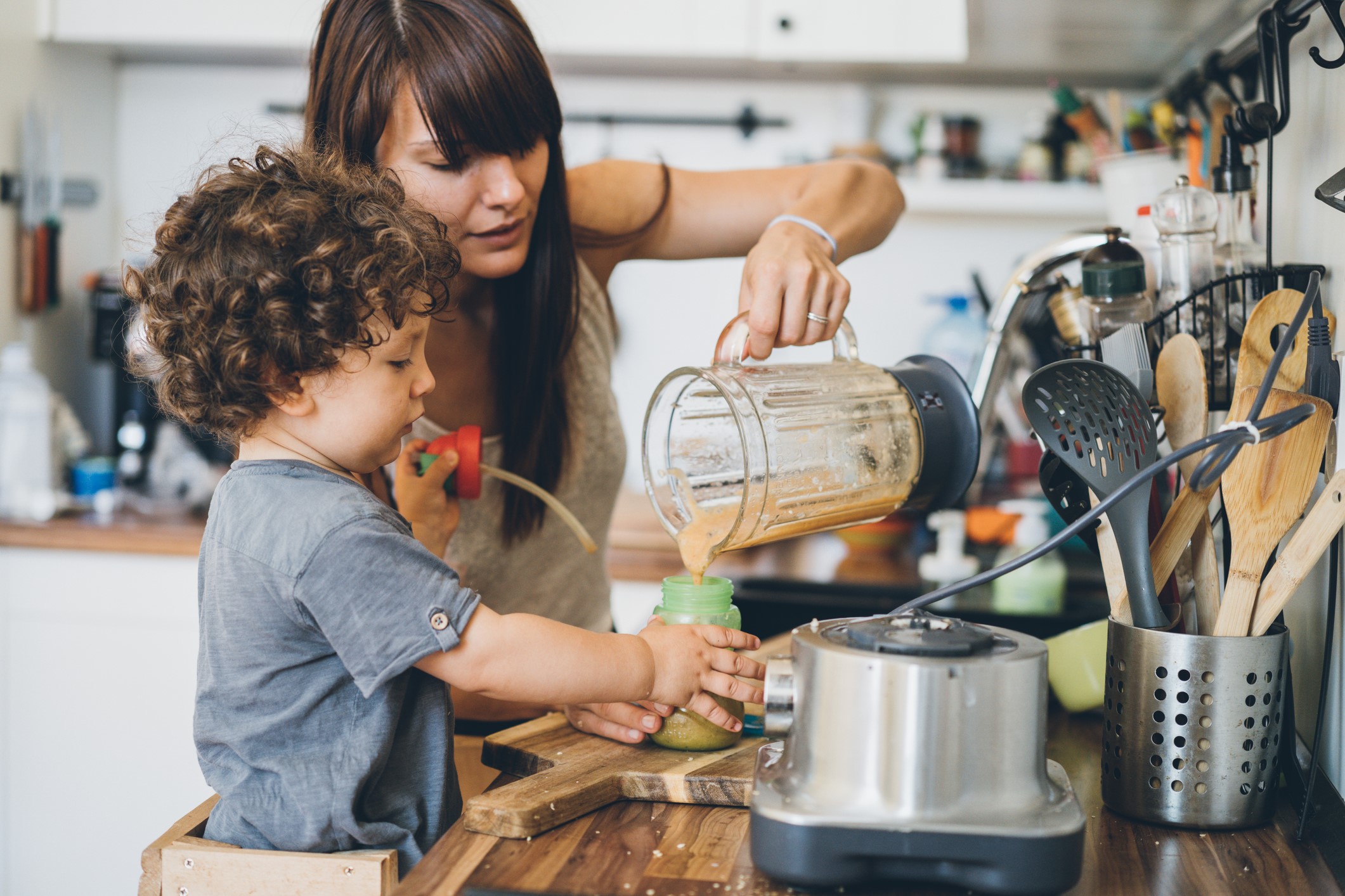 mother and son making a smoothie