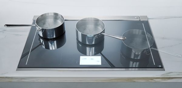 A Thermador induction cooktop with a sauce pan