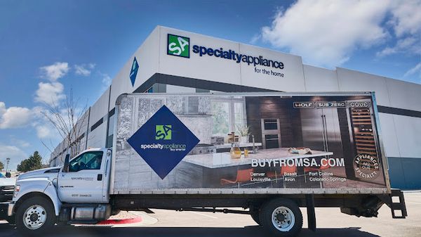 A Specialty Appliance delivery truck outside of a Specialty Appliance store 
