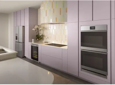 The Cafe CTD90DM2NS5 wall oven featured in a retro-style kitchen 
