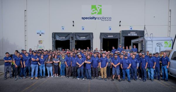 Specialty Appliance employees outside of a store 