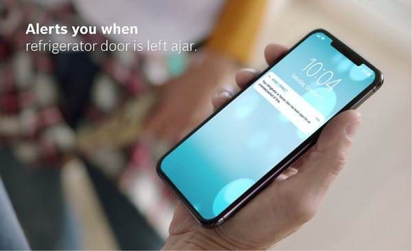 A person using the Home Connect app for a Bosch refrigerator 