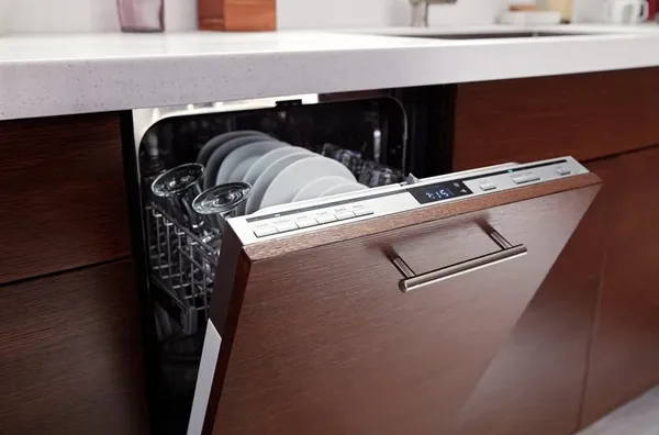 The KitchenAid UDPS5118PP dishwasher in a kitchen 