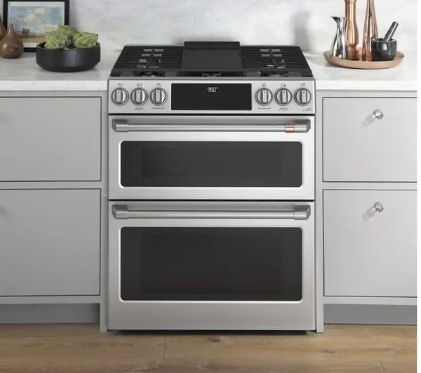 Front view of the Cafe dual fuel 30 inch range with griddle feature