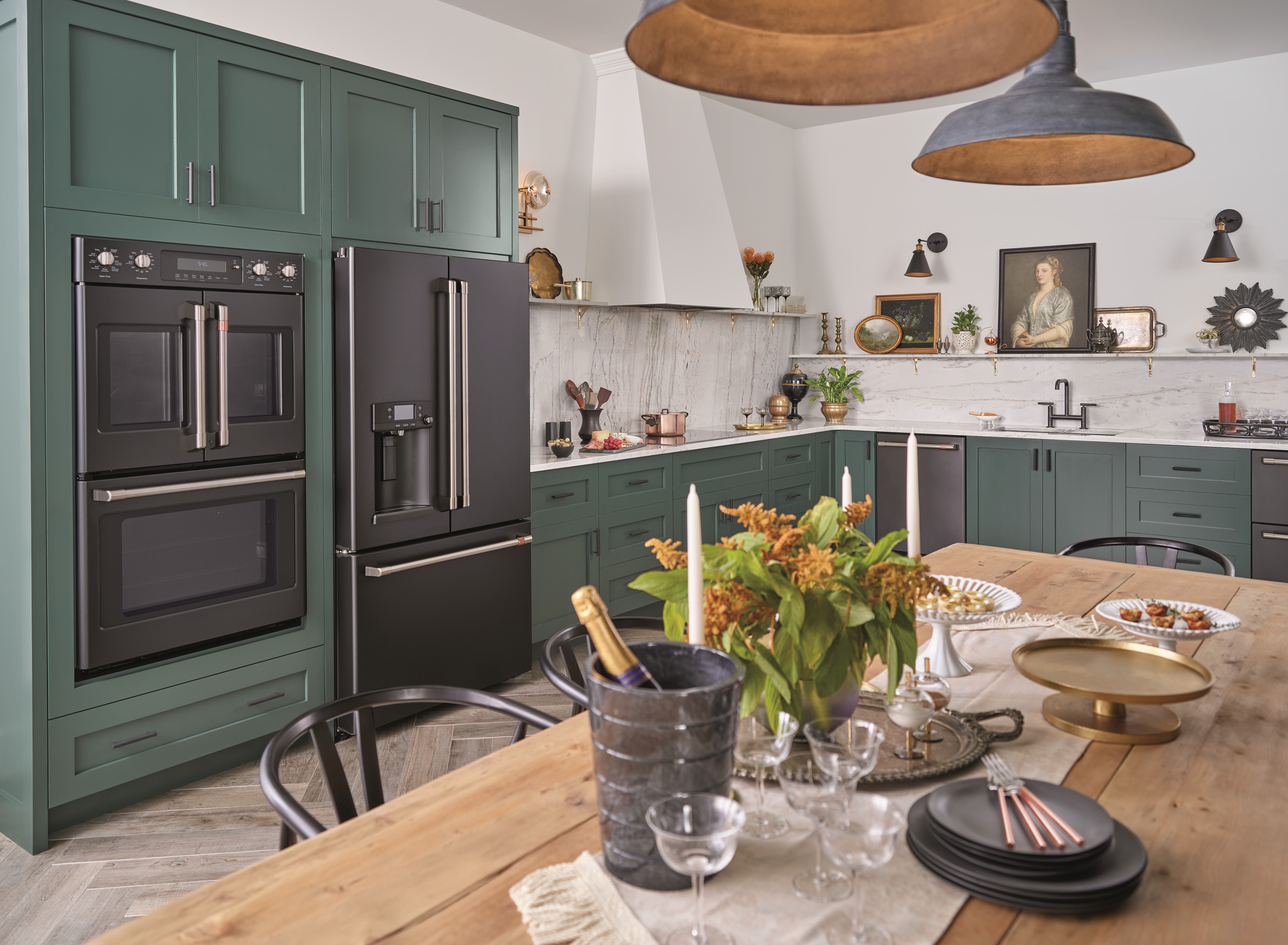 modern kitchen with teal cabinetry and black ge cafe appliances 