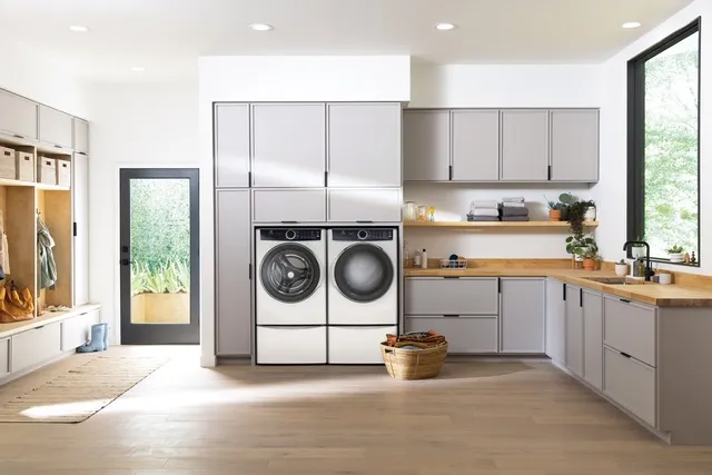 A matching Electrolux washer and dryer in a laundry room 