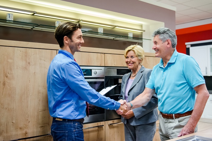 couple buying new kitchen appliance